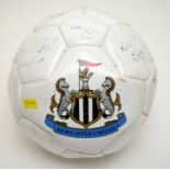 A signed Newcastle United F.C. football.