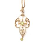 An Edwardian Art Nouveau peridot and pearl pendant.