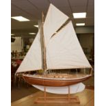 A 20th Century stained and white painted wood scale pond yacht