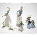 A collection of Lladro and Nao ceramic figures