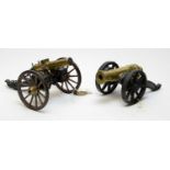 A desktop model of a Gatling field gun, and another