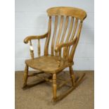 A Mid 19th Century ash and elm rocking chair.