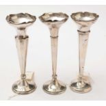 Three antique silver spill vases.