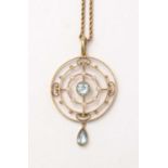 An Edwardian aquamarine and seed pearl pendant on chain.