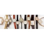 A group of dress wristwatches.