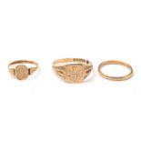 Two 9ct gold signet rings, and an 18ct gold wedding band.