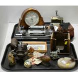 A selection of desk accessories including a barometer