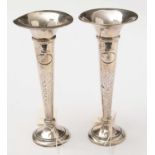 A pair of George V silver Arts and Crafts spill vases.