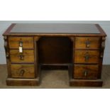 An early 20th Century mahogany kneehole desk