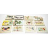 A collection of WWI silk embroidered and other postcards