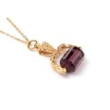 An H. Samuel amethyst and 9ct gold novelty fob seal pendant on chain.
