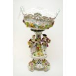 A late 19th Century ceramic Dresden figural and floral encrusted comport