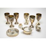 A selection of silver and plated wares including a set of six silver plated copper goblets