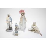 A collection of four Lladro figures