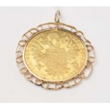 An Austrian 1915 gold four ducat coin, in a pendant mount.