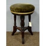 An Edwardian mahogany piano stool