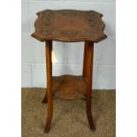 An early 20th Century carved beech occasional table