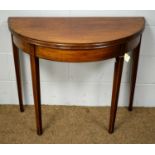 A 19th C. mahogany demi-lune tea table.