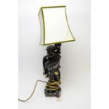 A Chinese hardwood figural table lamp