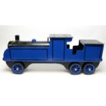 A wooden scratch-built sit-on locomotive.