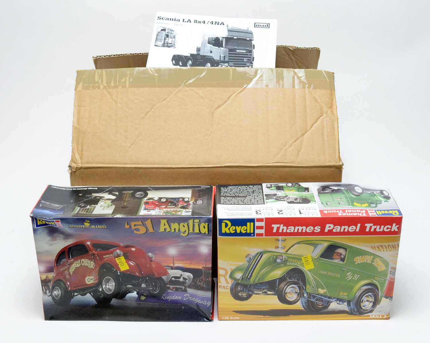 Two Revell scale model kits; and one Mad scale model kit.