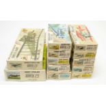 Twelve boxed Airfix model construction kits.