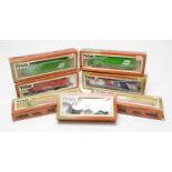 Seven boxed Tyco HO-gauge trains and rolling stock.