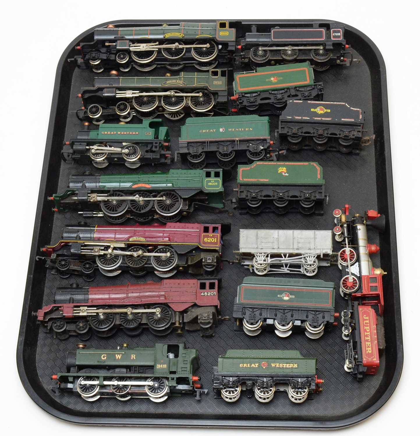 Nine 00-gauge unboxed locomotives and tenders.
