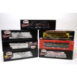 Seven boxed Atlas HO-gauge trains.