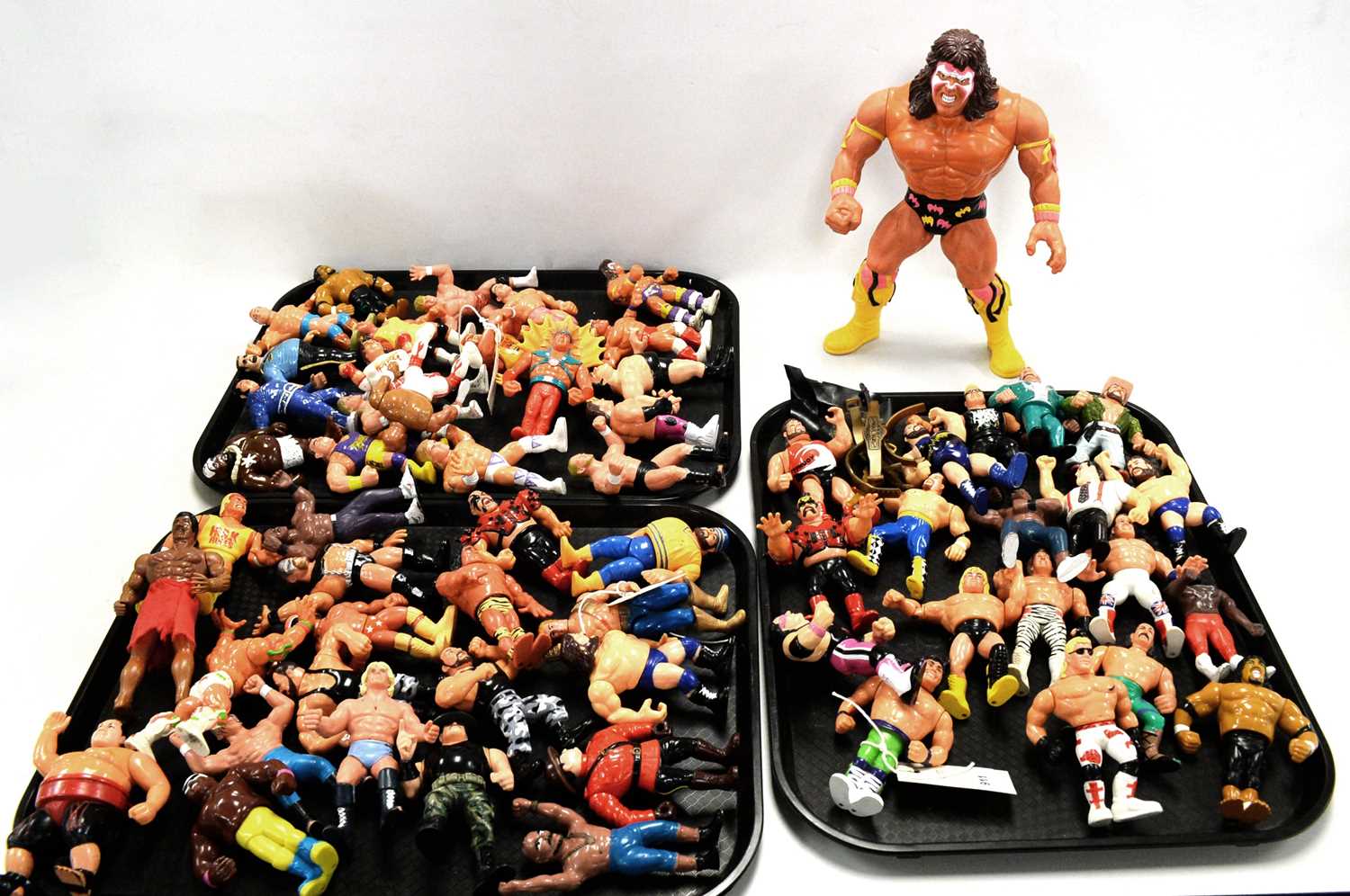 A collection of WWF and other action figures