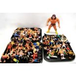 A collection of WWF and other action figures