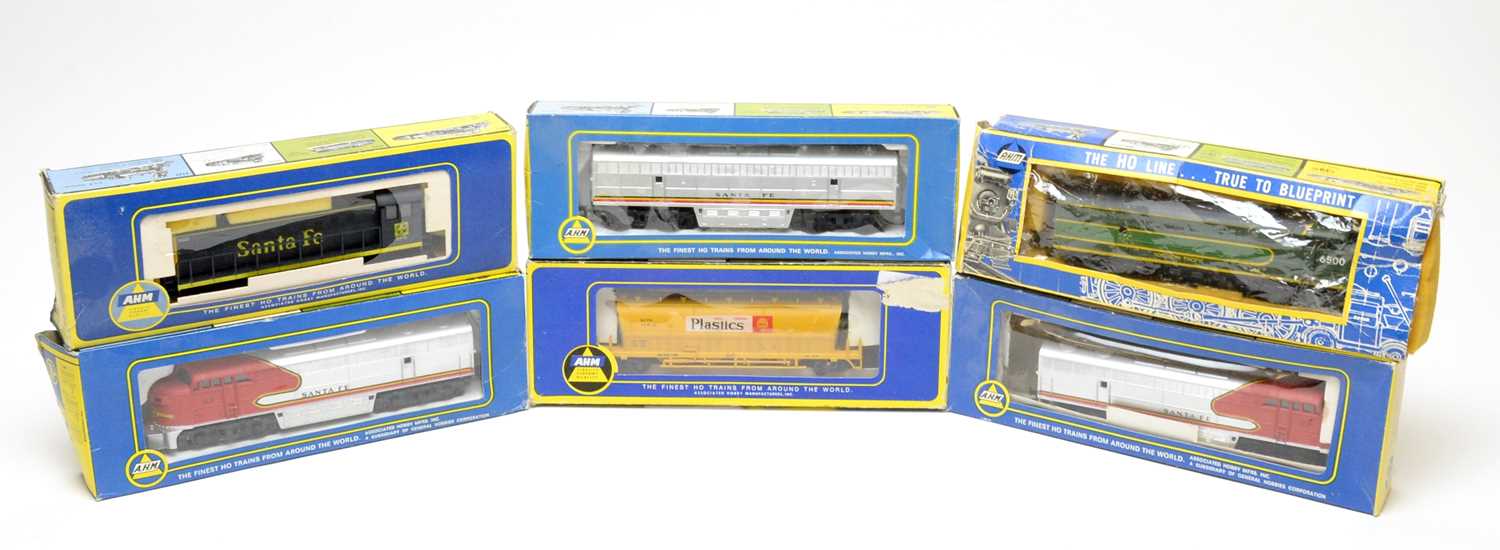 Six boxed AHM 00-gauge trains and rolling stock.