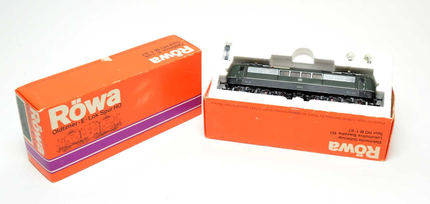 Two boxed Röwa HO-gauge trains.