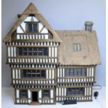 A Tudor-style doll's house by Robert Stubbs