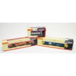 Three boxed Hornby trains.