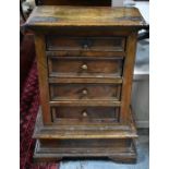 An antique North Italian walnut chest of four long moulded drawers