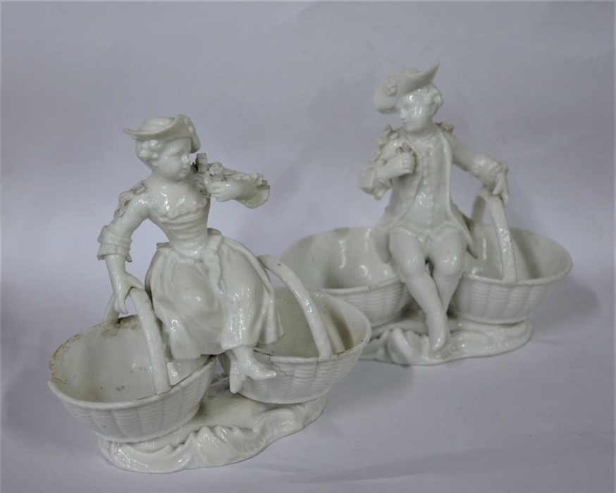 A pair of late 19th century Meissen blanc de chine porcelain cruets