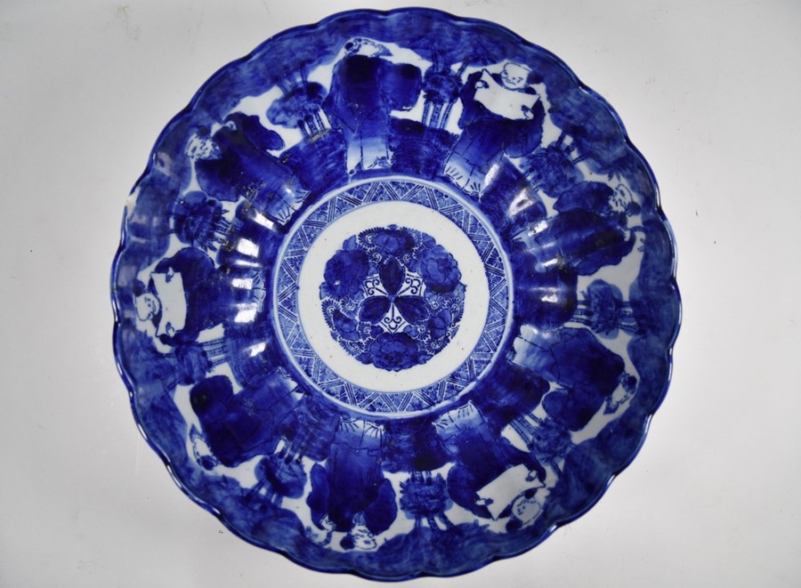 A 19th century Japanese blue and white floriform punch bowl - Image 3 of 4