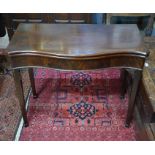 A Victorian mahogany serpentine form card table
