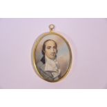 A George III oval portrait miniature in the manner of George Engleheart
