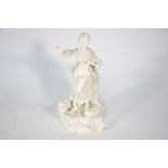 A white-glazed porcelain figure of an 18th century shepherdess