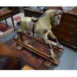 F H Ayres, London, a Victorian dapple grey wooden rocking horse