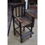 An antique oak child's high chair