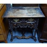 An antique oak side table in the William & Mary style