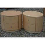 A pair of 'Dwell' modern ovoid two drawers bedside chests