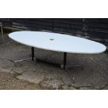 A modern white laminate/melamine oval boardroom table