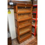 Globe Wernicke, an oak five section glazed library bookcase