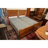 A pair of Edwardian burr walnut single beds