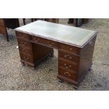 A mahogany twin pedestal desk