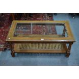 A mahogany rectangular glass-top coffee table